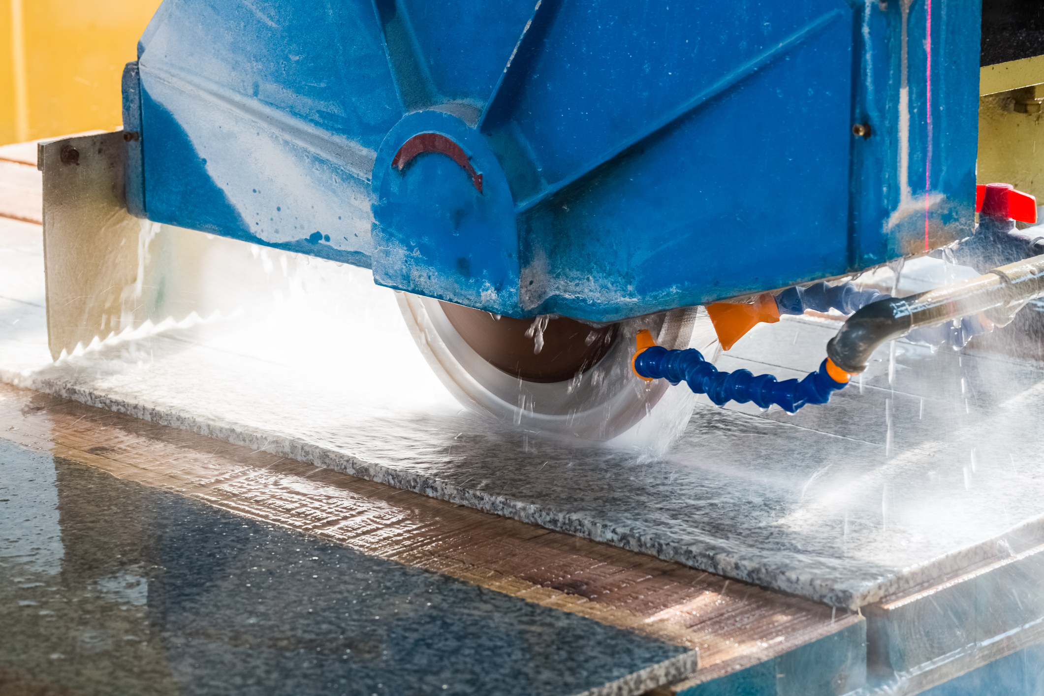 stone processing closeup , infrared ray electric column  bridge style cutting machine